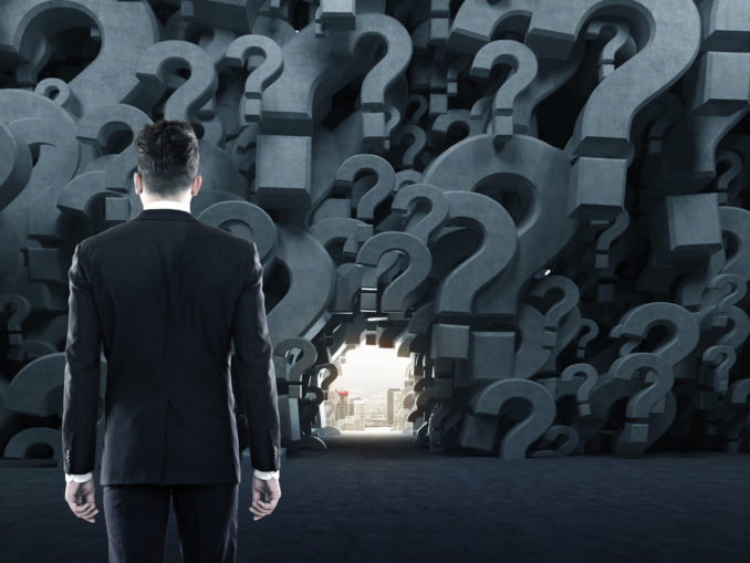 Man in a question mark room, close up