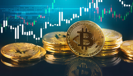 Bitcoins and New Virtual money concept.Gold bitcoins with Candle stick graph chart and digital background.Golden coin with icon letter B.Mining or blockchain technology