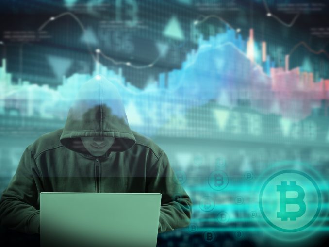 hooded male hacker and crypto currency concept
