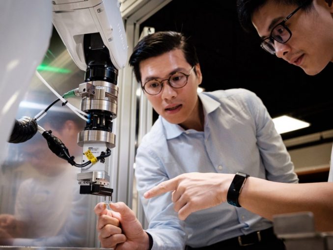 Photo-1-Assoc-Prof-Pham-Quang-Cuong-working-with-lead-engineer-Dr-Pham-Tien-Hung-who-was-his-graduate-student