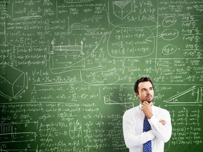 thinking man against desk with formulas Mit der digitalen Transformation werden hybride Business-IT-Rollen entstehen. (c) kantver - Fotolia