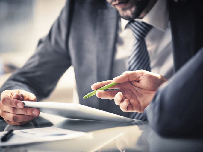 iStock_two_men_explaining_with_iPad